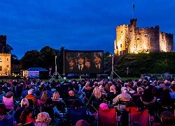 Families enjoying outdoor Cinema at Cardiff Castle, including Harry Potter Families enjoying outdoor Cinema at Cardiff Castle, including Harry Potter