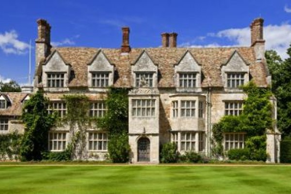 Anglesey Abbey built in grey stone looking beautiful on Summer's day