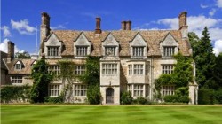 Anglesey Abbey built in grey stone looking beautiful on Summer's day