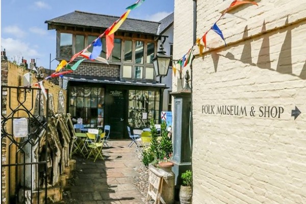 The outside of Cambridge Folk Museum seen from the gates