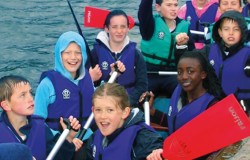 Kids having a great day out in a boat on the water