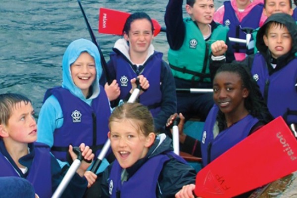 Kids having a great day out in a boat on the water