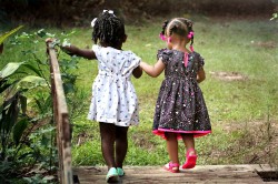 2 pretty young girls in summer dresses enjoying their day out