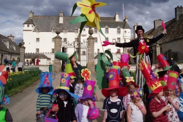 Kids having fun with Traquair House in the background